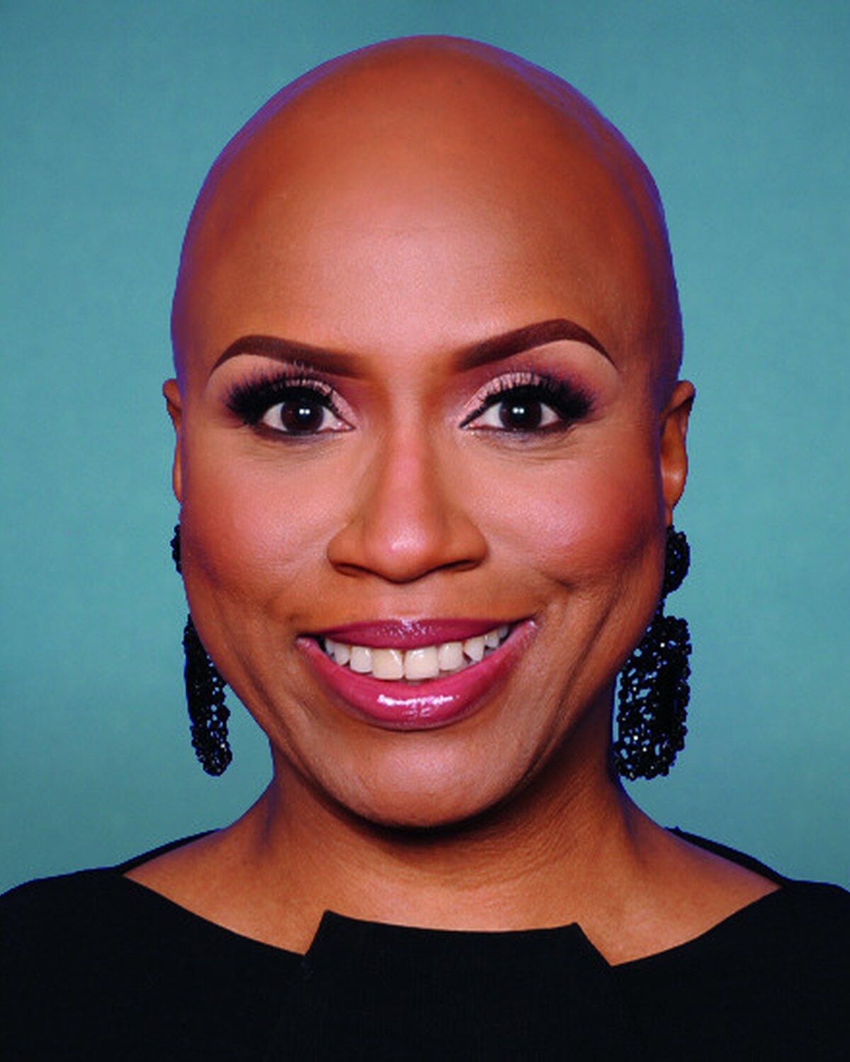 Official portrait of Ayanna S. Pressley, United States Representative for Massachusetts's 7th Congressional District.