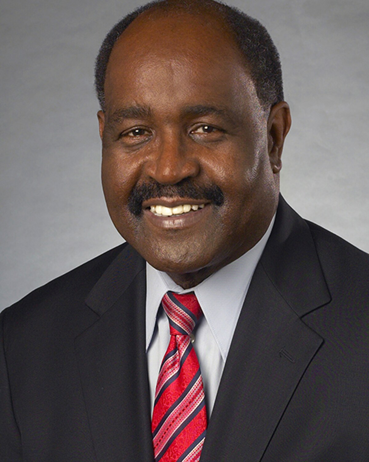 Official portrait of Bud L. Williams, Massachusetts State Representative for the 11th Hampden District.
