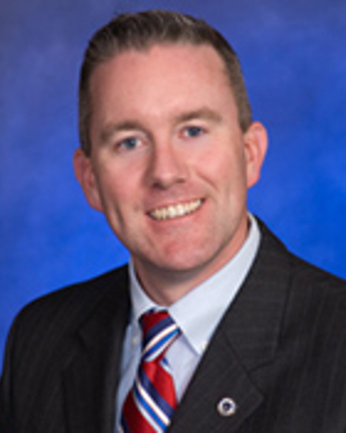 Official portrait of Michael F. "Mike" Rush, Massachusetts State Senator for the Norfolk and Suffolk District.
