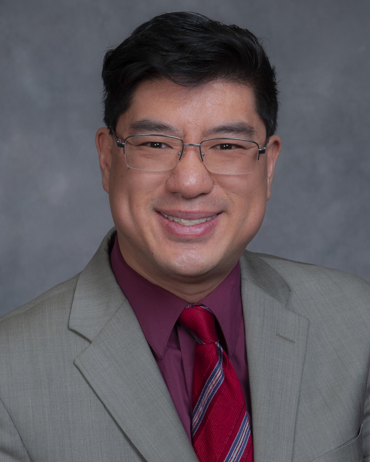 Official portrait of Tackey Chan, Massachusetts State Representative for the 2nd Norfolk District.
